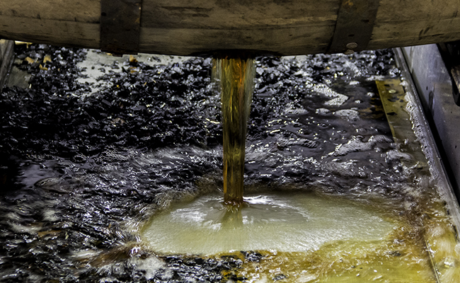 A barrel of Bourbon being dumped at the Jim Beam Distillery in Clermont, Kentucky. Photo ©2013, Mark Gillespie.