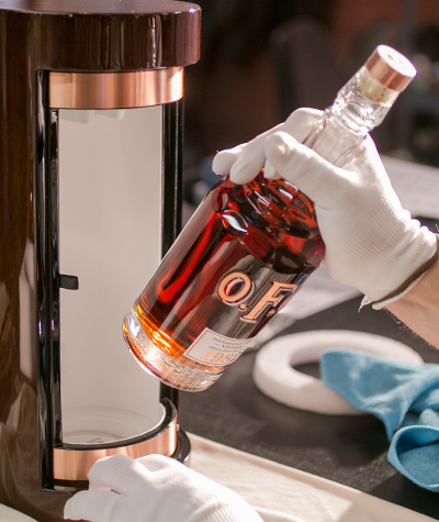 A bottle of Buffalo Trace's O.F.C. Vintage 1982 Bourbon being placed in its presentation box. Image courtesy Buffalo Trace.