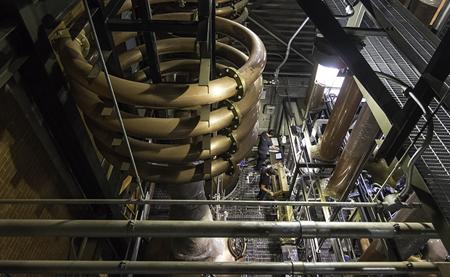 The unique coiled Lyne arms at the top of the spirit stills at Balcones Distilling in Waco, Texas. Photo ©2017, Mark Gillespie, CaskStrength Media.