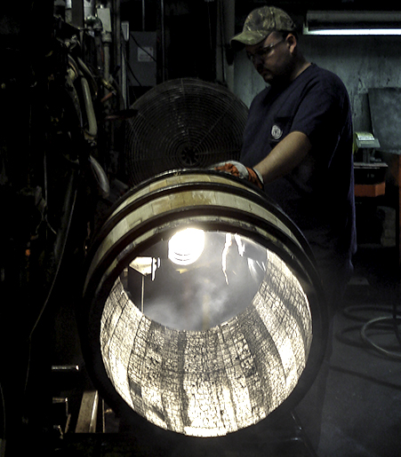 An International Stave cooper examines a barrel at the company's Lebanon, Kentucky cooperage. File photo ©2017, Mark Gillespie/CaskStrength Media.