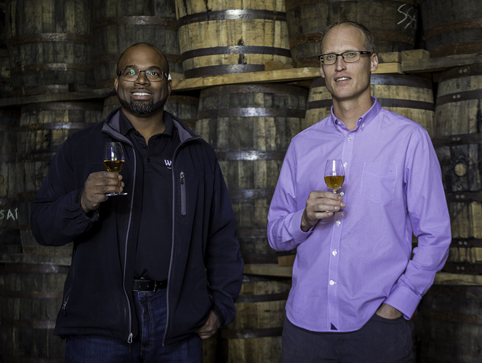 Hiram Walker Distillery warehouse supervisor Donald Campbell (L) and Master Blender Dr. Don Livermore (R) in one of the 16 maturation warehouses at the distillery's warehouse campus near Windsor, Ontario. Photo ©2017, Mark Gillespie, CaskStrength Media.