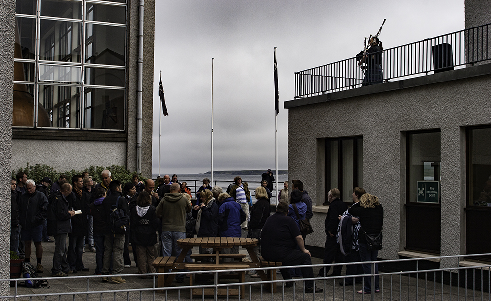 A bagpiper greets visitors at Diageo's Caol Ila Distillery during the annual Islay Festival of Malt & Music. File Photo ©2018, Mark Gillespie/CaskStrength Media.