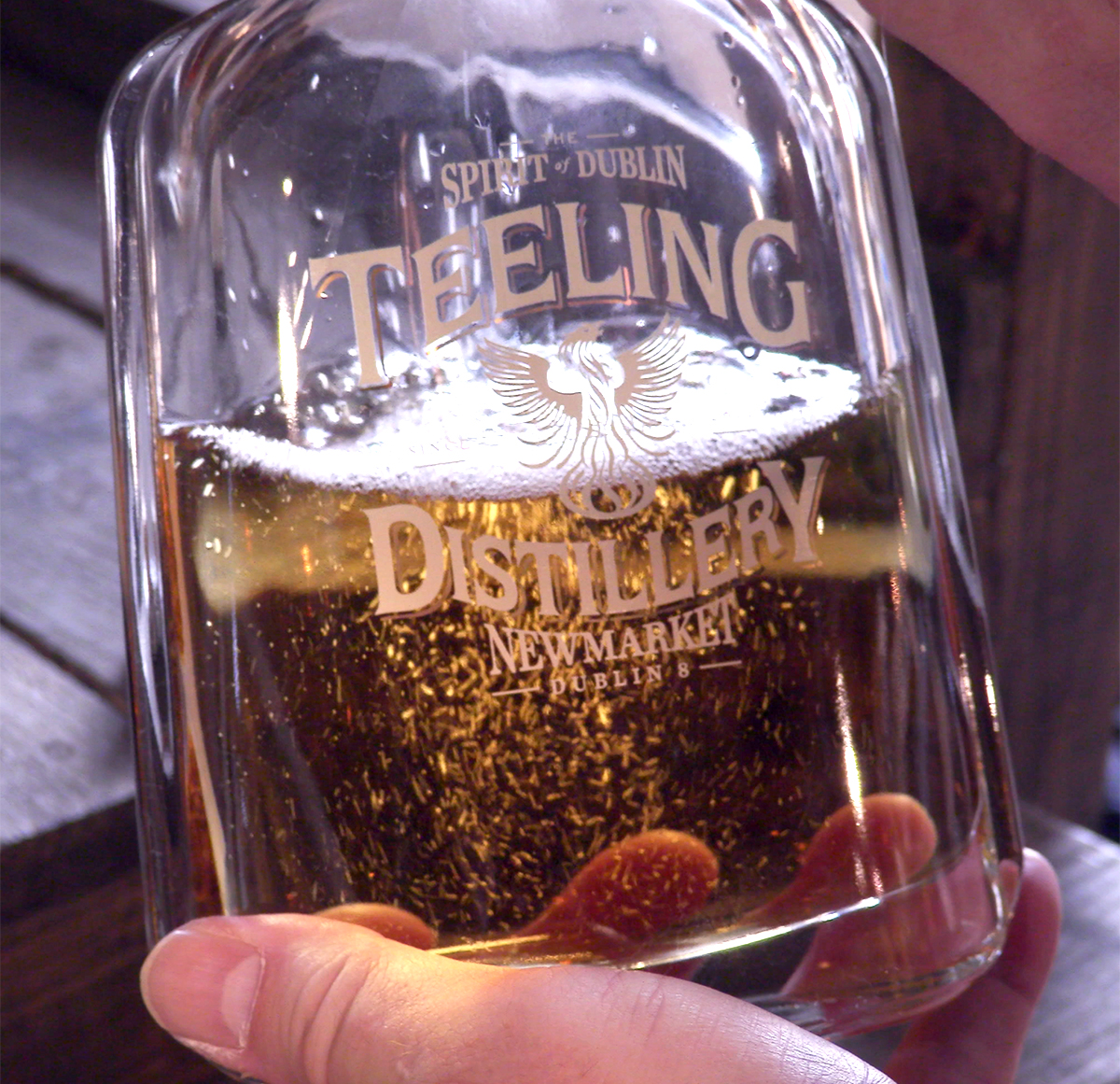 A bottle of whiskey being hand-filled in the Teeling Whiskey Company gift shop in Dublin. Photo ©2019, Mark Gillespie/CaskStrength Media.