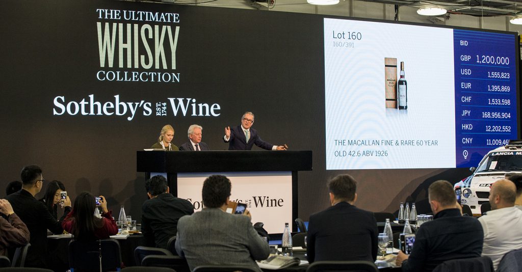 Sotheby's Wine Chairman Jamie Ritchie calls on bidders during the "Ultimate Whisky Collection" auction at London's Olympia on October 24, 2019. Image courtesy Sotheby's. 