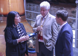 Speyside Distillers managing director Patricia Dillon (L) talks with CEO John McDonough and soccer star Michael Owen during a 2015 tour of the distillery. File photo ©2020, Mark Gillespie/CaskStrength Media.