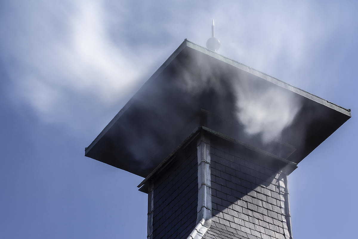 Peat smoke flows from the chimney at Highland Park Distillery in Kirkwall, Scotland. Photo ©2020, Mark Gillespie/CaskStrength Media.