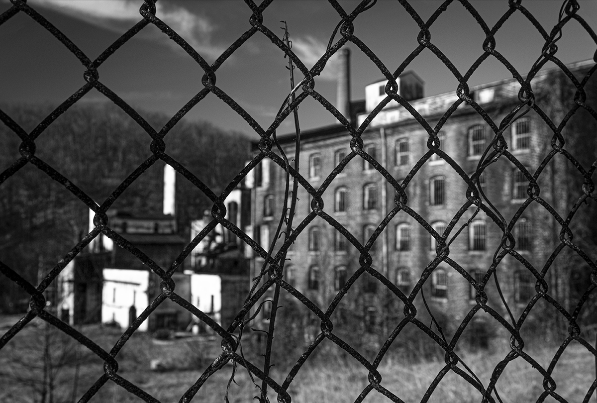 A fence hides what remains of the Old Crow Distillery in Woodford County, Kentucky. File Photo ©2020, Mark Gillespie/CaskStrength Media.